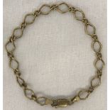 A decorative link 9ct gold bracelet. One link needs attention.