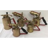 4 vintage brass blow lamps together with a vintage brass sprayer.