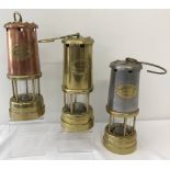 3 vintage brass miners lamps with "Lamp & Limelight Company, Hockley" name plates.
