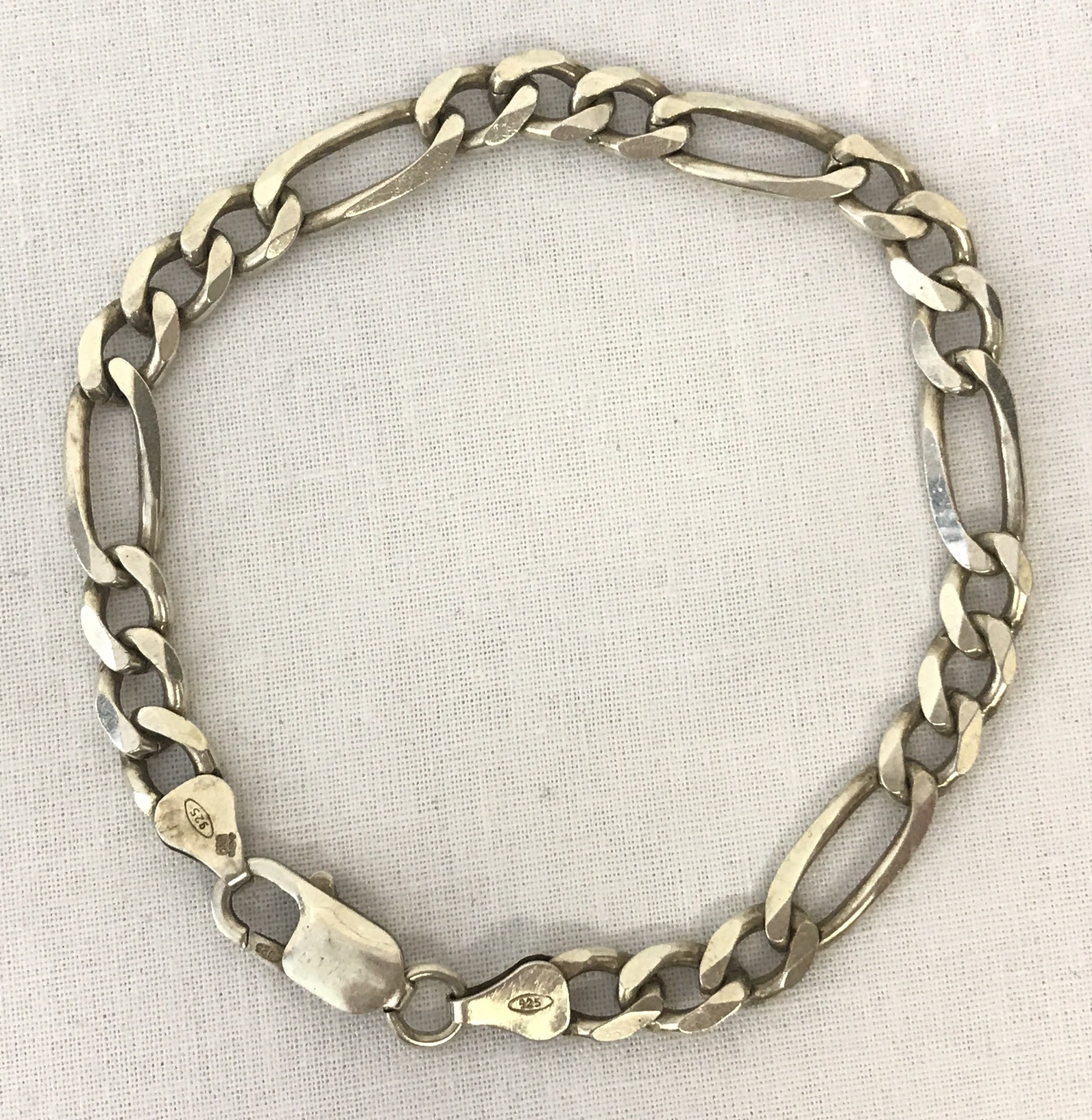 A silver Figaro design bracelet with lobster clasp.