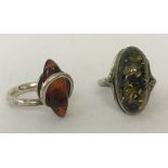 2 modern design amber rings. Both marked 925.