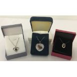 3 boxed silver necklaces.
