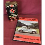A vintage Double TT lightening degreaser tin together with a Morris Minor 1000 workshop manual.