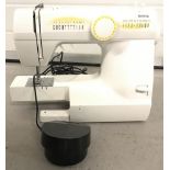 Toyota electric sewing machine with foot pedal & lead.