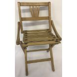 A vintage folding wooden child's chair, made in Czechoslovakia.
