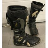 A pair of Raptor Performance MX motorcycle boots.
