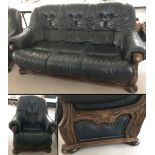 A solid wood frame and dark blue leather 3 seater sofa and matching armchair.