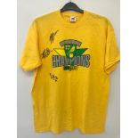 A Norwich City FC league one T shirt signed by Grant Holt, Wes Hoolahan and Chris Martin.