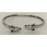 A 925 silver bangle with dolphin head detail.