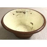 A large glazed terracotta dough bowl a/f.