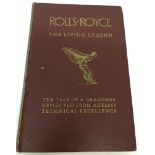 A 1958 publication of "Rolls-Royce The Living Legend." by Post Motor Books with burgundy cover.