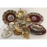 A box of assorted gilded ceramics.