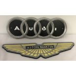 2 painted cast iron, wall hanging motoring plaques; Audi and Aston Martin.