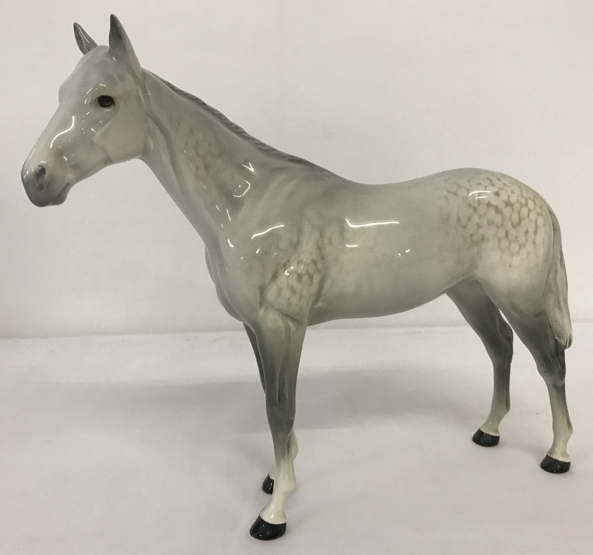 A Beswick ceramic Bois Roussel racehorse figurine in dapple grey.