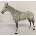 A Beswick ceramic Bois Roussel racehorse figurine in dapple grey.