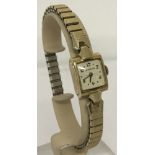 A vintage ladies 10k gold filled wristwatch by Le Coultre, with expandable strap.