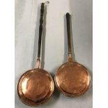 2 vintage copper warming pans with hammered detail to lids and wooden handles.