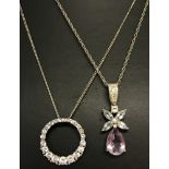 An angel design pendant set with amethyst, blue topaz and clear stones on a fine rope chain.