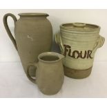 3 large stoneware items. A lidded Flour jar together with 2 jugs.