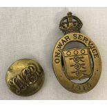 A brass WWI "On War Service" 1915 lapel button badge together with a vintage brass LNER button.