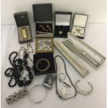 A collection of boxed and unboxed vintage and modern costume jewellery.