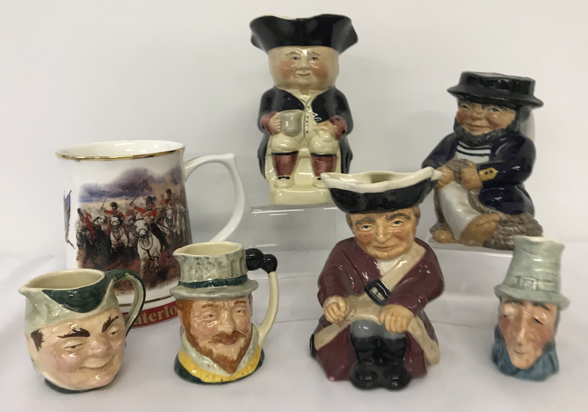 A collection of 6 vintage ceramic toby jugs together with a Danbury Mint "Waterloo" tankard.