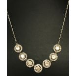 A decorative clear and champagne stone set dress necklace.