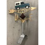 A modern painted cast metal weather vane with Land Rover detail.