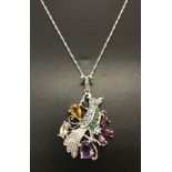 A modern design amethyst, topaz and citrine set decorative bird pendant.