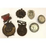 A collection of 4 Chinese medals together with 2 badges.