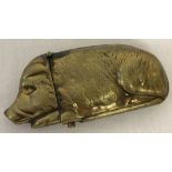 A novelty brass vesta case in the shape of a pig.