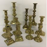 6 pairs of Victorian brass candlesticks with pushers.