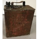 A 1949 2 gallon Shell metal petrol can with cap.