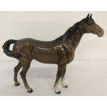 A Beswick ceramic horse, swish tail, figurine #1182, first version with higher tail.