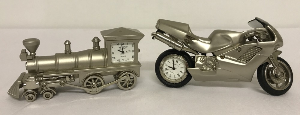 2 novelty diecast model clocks in the shape of a train and a motorcycle.