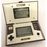 A vintage Nintendo multi screen Donkey Kong II handheld electronic game.