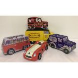 5 novelty biscuit tins in shape of vehicles.