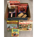 A box of mixed vintage games.