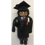 A vintage London Owl Company "Graduate" owl, complete with mortar board and leather bound book.