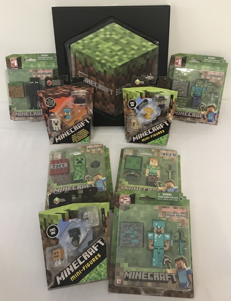 A boxed Minecraft Blockopedia. Together with 8 unopened blister pack Minecraft figures.