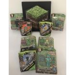 A boxed Minecraft Blockopedia. Together with 8 unopened blister pack Minecraft figures.