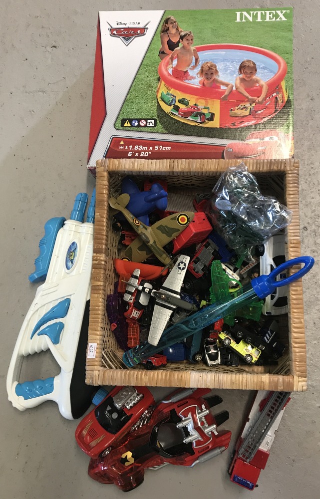 A collection of assorted toys to include boxed and sealed Disney Cars paddling pool.