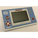 A vintage Nintendo Super Mario Bros. handheld electronic game.