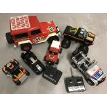 A box of remote control vehicles to include a monster truck and dune buggy.