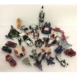 A collection of vintage Transformer toys by Hasbro, Bandai and others.