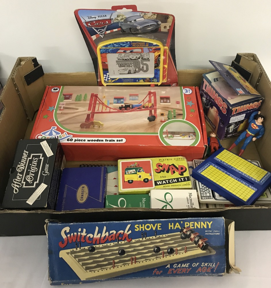A collection of vintage games and packs of playing cards.