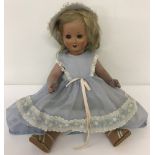 A 1930's ceramic fully jointed doll with flirty eyes.