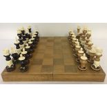 A complete boxed hand-made chess set from Central Mexico. Constructed of wood & ox bone.