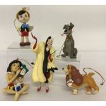 A collection of 5 Disney Christmas tree hanging ornaments.