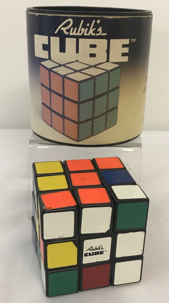 A vintage 1981 Rubik's cube by Ideal, in original cylindrical box.